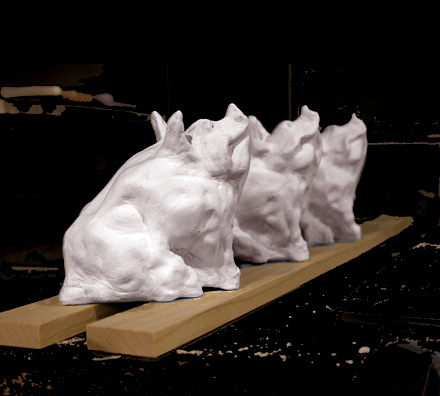 Porcelain Pigs in a Row